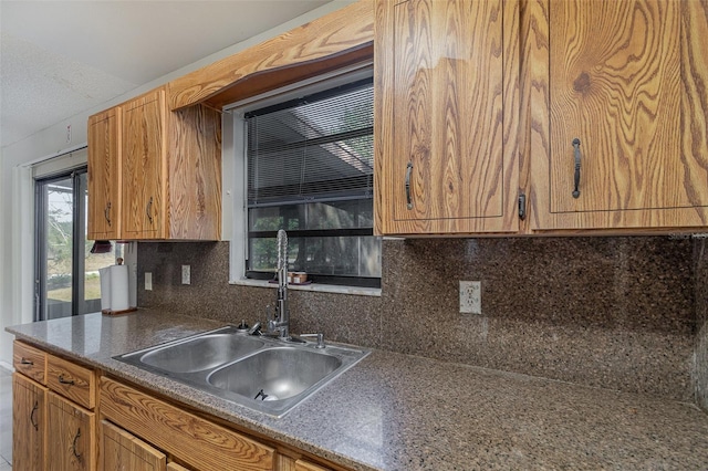 kitchen with decorative backsplash and sink