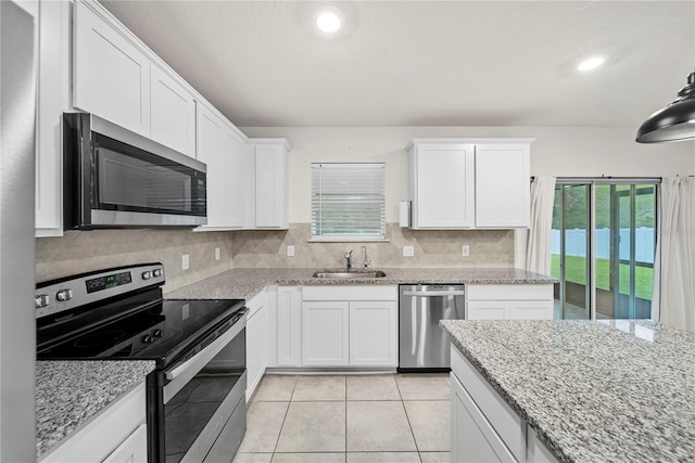 kitchen featuring white cabinetry, appliances with stainless steel finishes, and sink