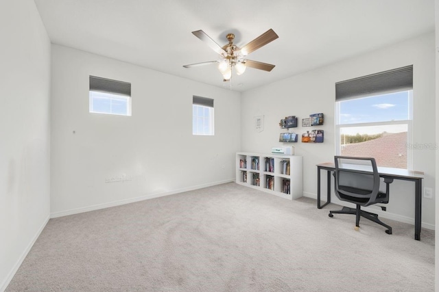 carpeted office with ceiling fan