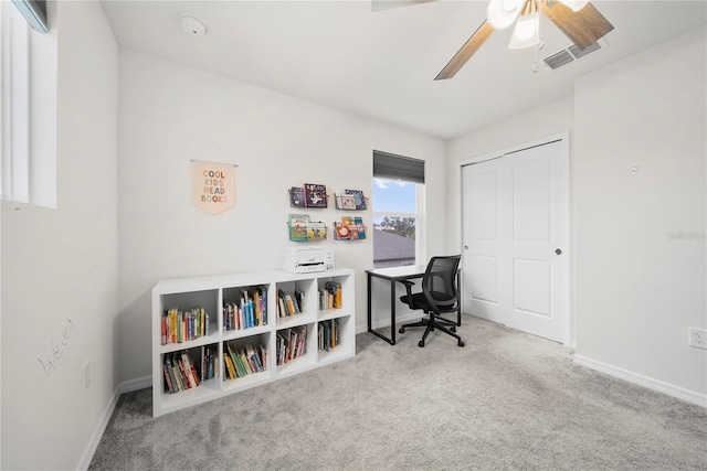 office area featuring ceiling fan and carpet