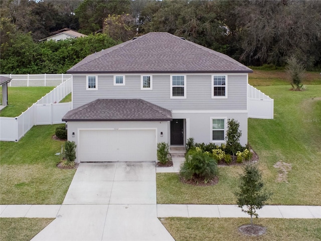 view of front facade with a garage and a front lawn