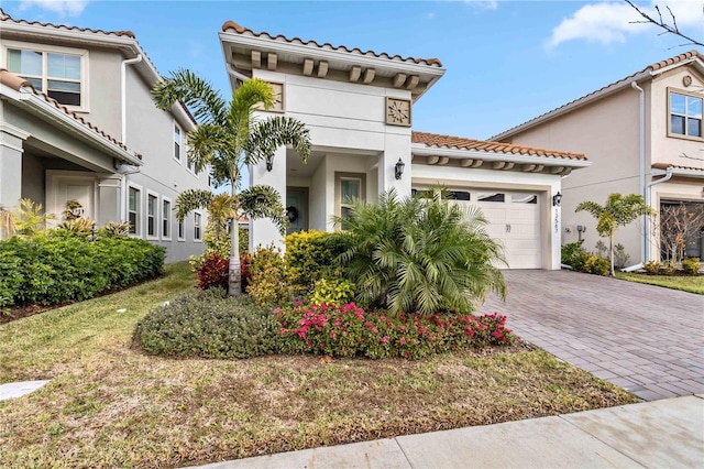 mediterranean / spanish house featuring a garage