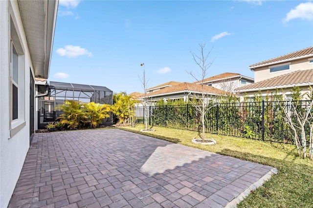 view of patio / terrace featuring glass enclosure