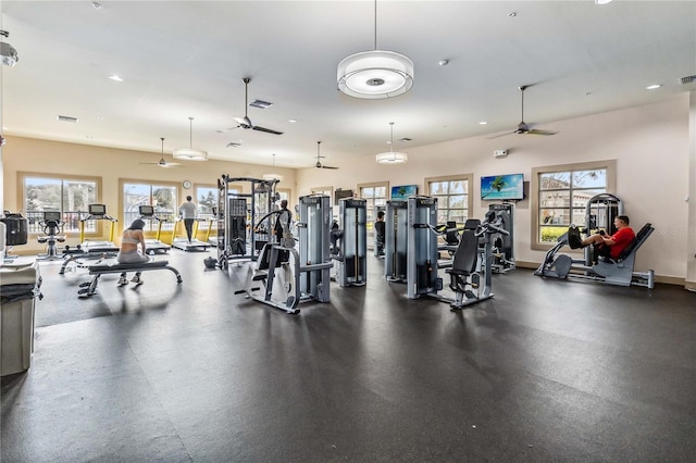 workout area with ceiling fan and a healthy amount of sunlight