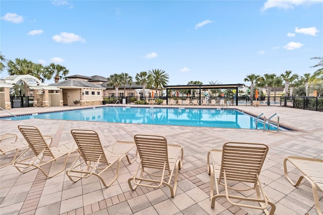 view of swimming pool with a patio area