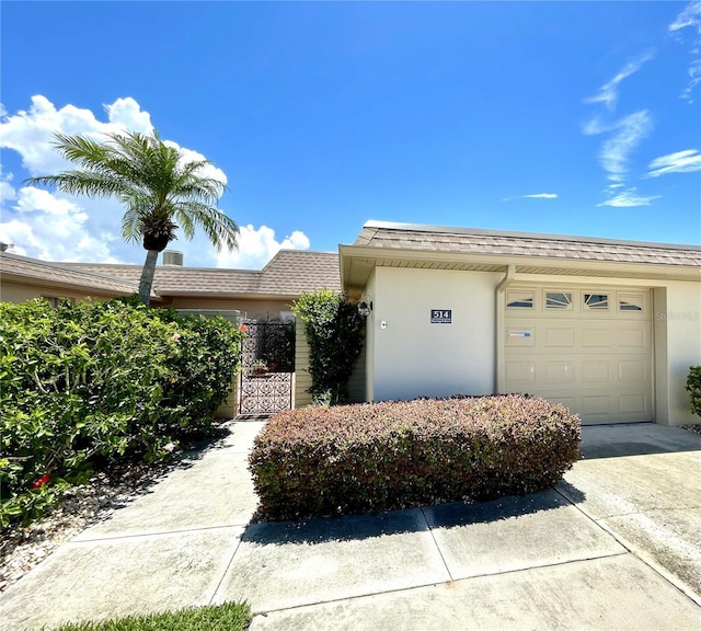 single story home featuring a garage