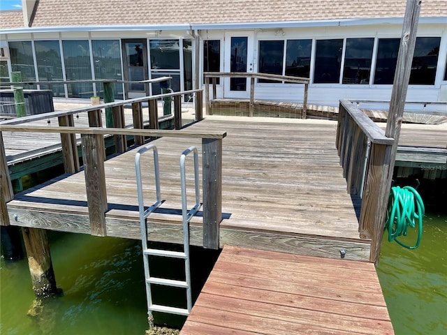 dock area with a water view