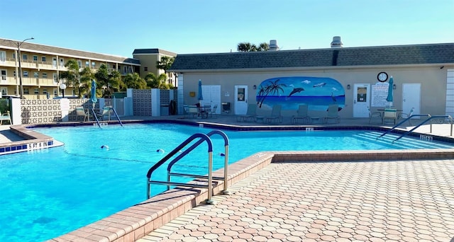 view of swimming pool featuring a patio