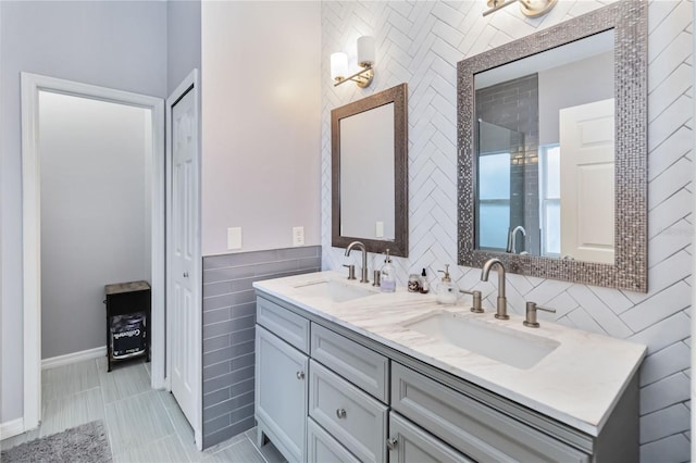 bathroom with tile walls and vanity