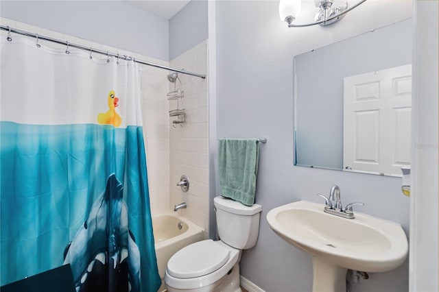 full bathroom featuring shower / bathtub combination with curtain, sink, and toilet