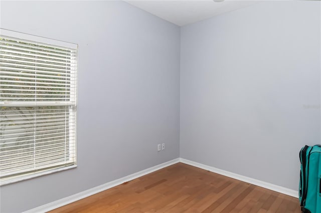 spare room with hardwood / wood-style flooring