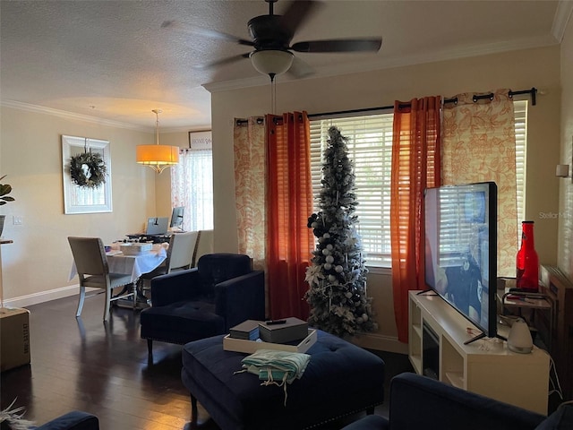 living room with a textured ceiling, ceiling fan, crown molding, and dark hardwood / wood-style flooring