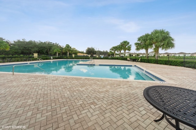 view of swimming pool featuring a patio