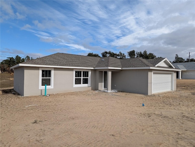 ranch-style home featuring a garage