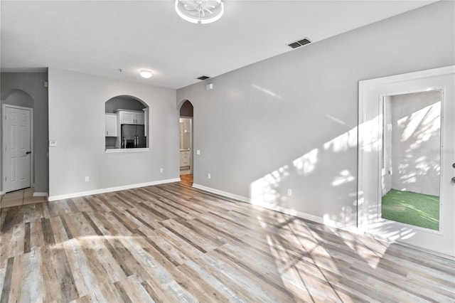 unfurnished living room with light hardwood / wood-style floors