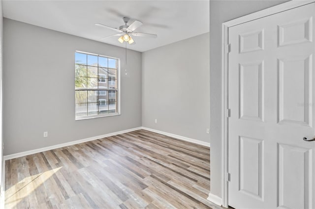 spare room featuring ceiling fan and light hardwood / wood-style floors