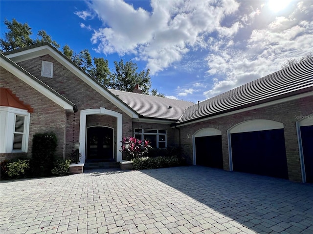 ranch-style house featuring a garage