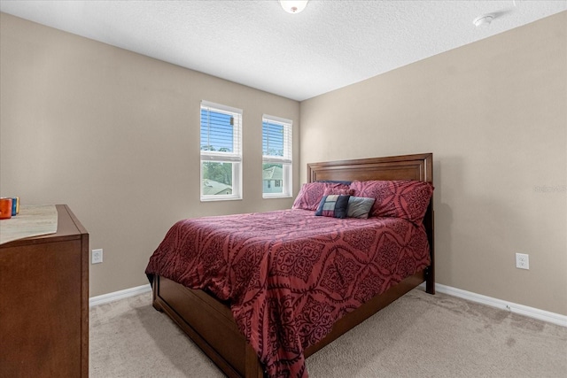 bedroom featuring light carpet