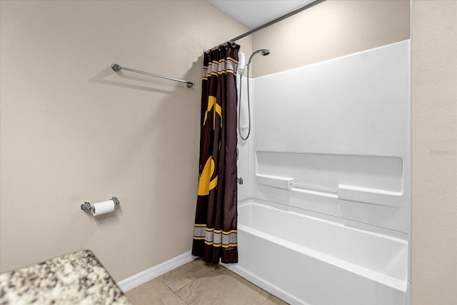 bathroom featuring tile patterned floors and shower / bath combo with shower curtain