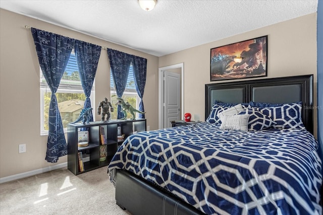 carpeted bedroom with a textured ceiling