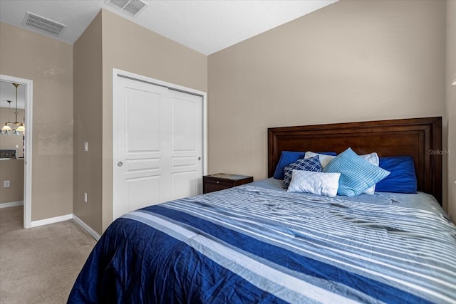 carpeted bedroom with a closet