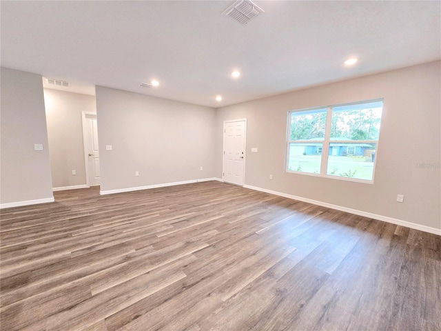 empty room with wood-type flooring