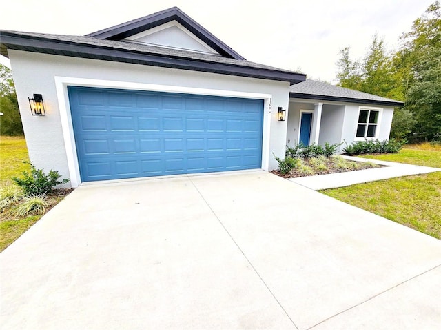 ranch-style house featuring a garage