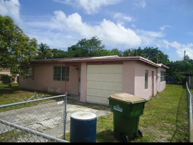 view of side of property with a lawn