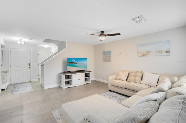 living room featuring ceiling fan