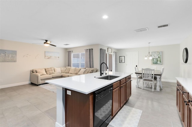 kitchen with sink, dishwasher, an island with sink, pendant lighting, and ceiling fan