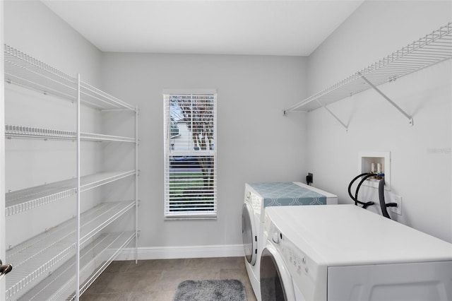 washroom with a wealth of natural light and washer and clothes dryer