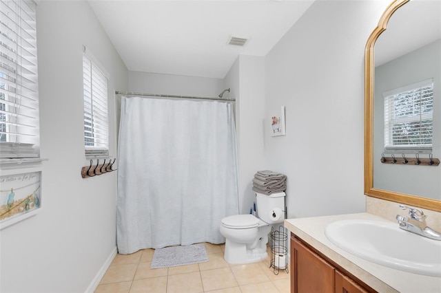 bathroom with tile patterned floors, toilet, and vanity