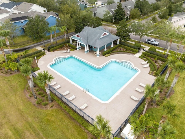 view of pool featuring a lawn and a patio area