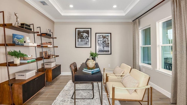 office with a raised ceiling and ornamental molding