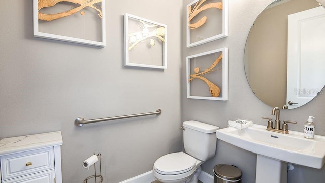 bathroom with toilet and sink