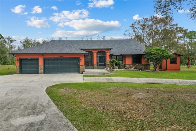 single story home with a garage and a front yard