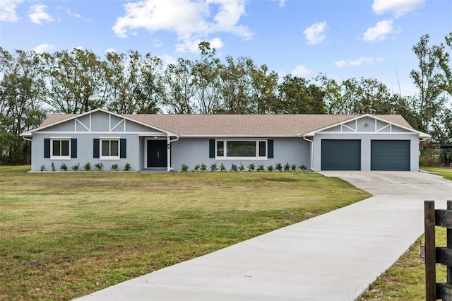 single story home with a front yard and a garage