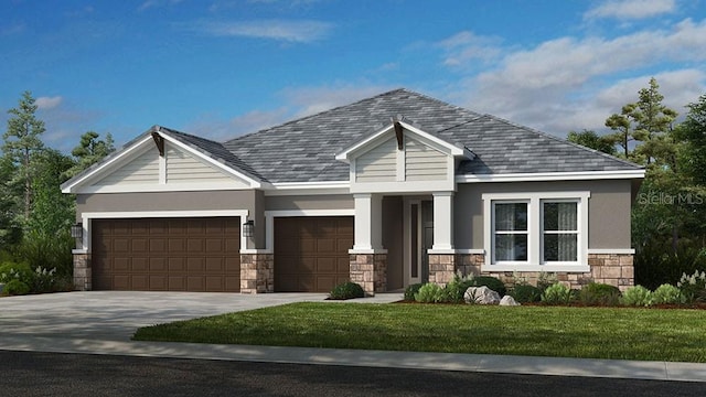 craftsman house featuring a front lawn and a garage