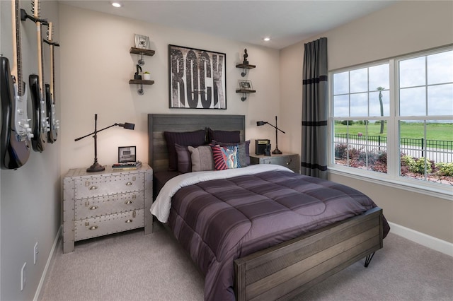 bedroom featuring light colored carpet