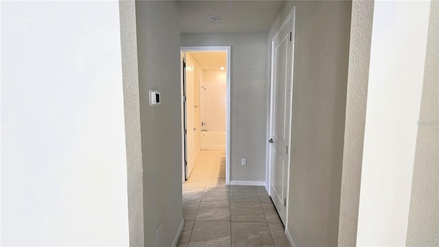 corridor featuring tile patterned flooring