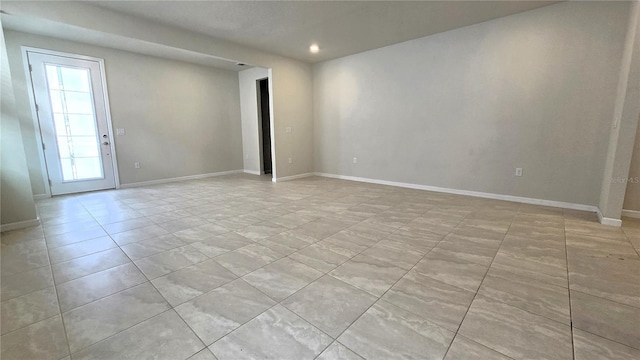 unfurnished room featuring plenty of natural light