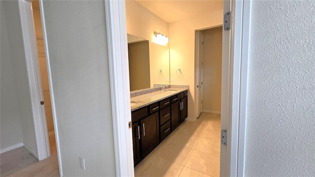 bathroom with tile patterned flooring and vanity