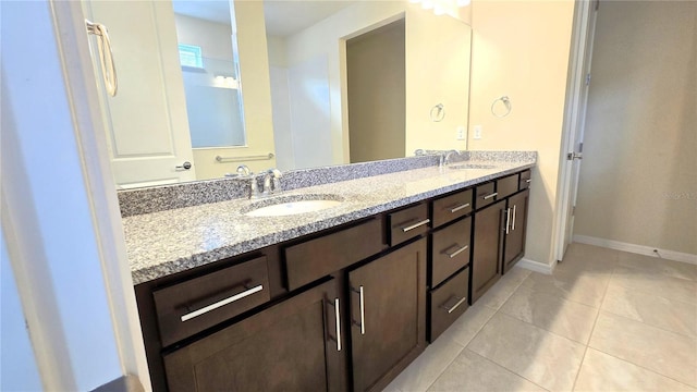 bathroom featuring vanity and tile patterned flooring