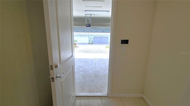 hallway featuring light tile patterned flooring