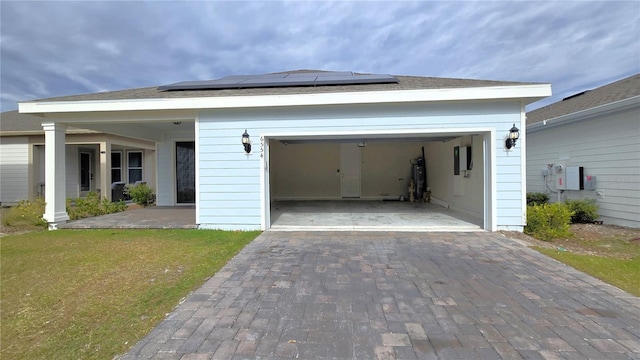 view of front facade featuring a front yard and a garage