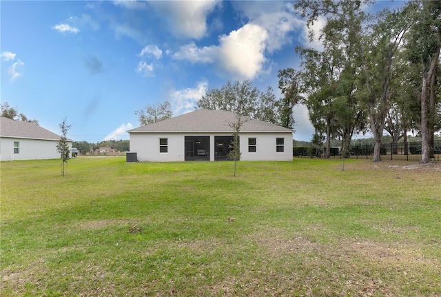 back of house with a yard