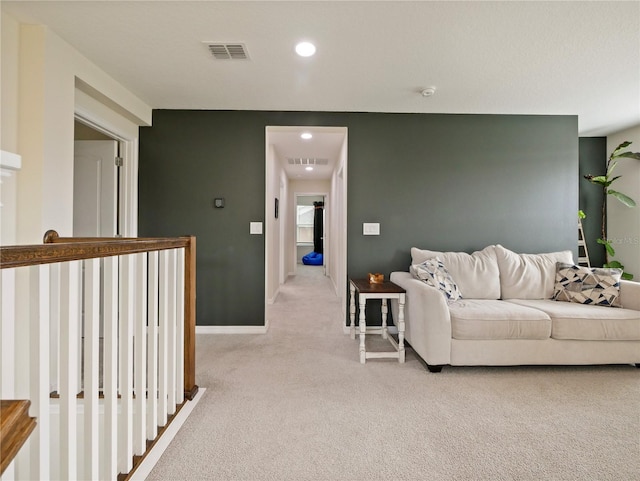 living room featuring light carpet