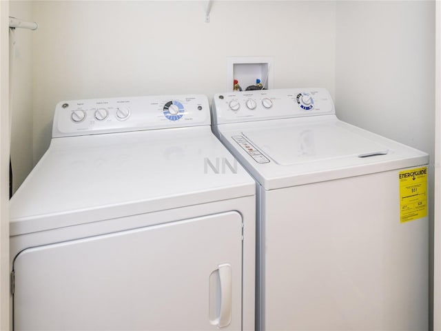 laundry area featuring washing machine and clothes dryer