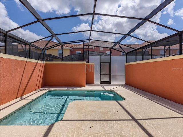 view of pool with a lanai and a patio area