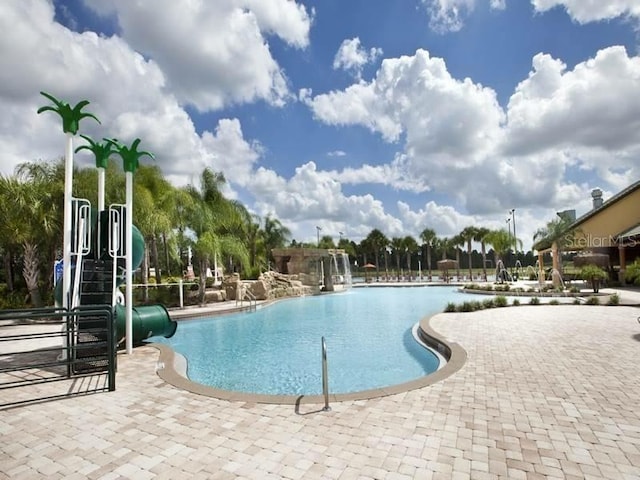 view of swimming pool featuring a water slide